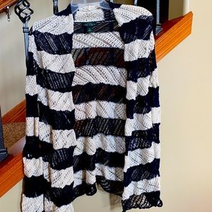 This crocheted cardigan is from Ralph Lauren in a size small in navy and cream